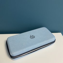 A gray, rectangular essential oils kit containing 36 essential oil bottles in a compact, organized storage case.