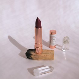 Amethyst 4.0 Natural Lipstick, a deep purple-red lipstick with a creamy, moisturizing formula.