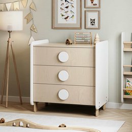  A modern, minimalist kids wardrobe with 3 drawers in a neutral beige color and wooden legs.