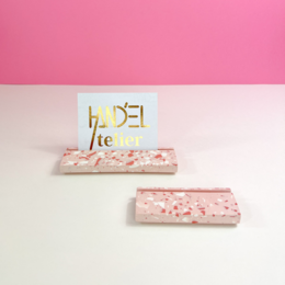 Blush terrazzo photo/card/display stand with a pink and white speckled pattern.