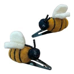 Handmade felt wool bee hair clips, yellow in color, designed for kids. Unique and whimsical accessory made in Nepal.