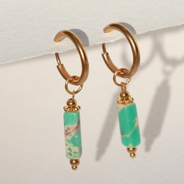 Turquoise stone earrings with gold-tone hoops and accents.