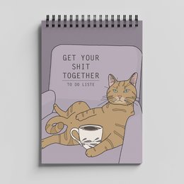 A5 size spiral-bound notepad with a cat illustration and the text "Get your shit together to do list" on the cover. The notepad has a patterned background with various icons and designs.