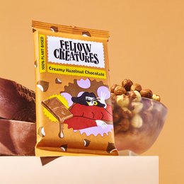 Creamy hazelnut chocolate snack bars in a colorful package featuring a cartoon character. The product is a multi-pack of 10 individually wrapped bars.