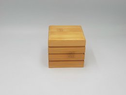 Bamboo soap box with solid shampoo travel compartment. Rectangular shape, natural wood color.