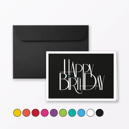 A folding birthday card with the text "Happy Birthday" in a stylized font, available in various color variants including blue, yellow, green, orange, pink, red, black, turquoise, purple, and white. The card comes with an envelope.