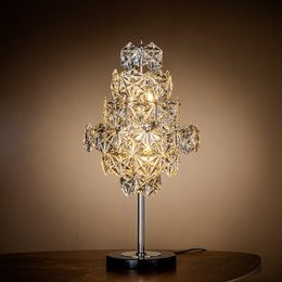 Tall, ornate crystal lamp base with a decorative, tiered design and a chrome finish.
