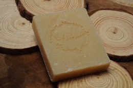 Coconut and shea soap bar with natural ingredients and a simple, organic design.