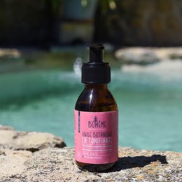 Organic body oil with natural ingredients like lavender, rosemary, and vitamin E for firming and toning skin.