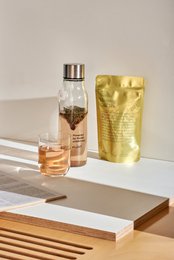 Organic blueberry tea with a Nordic morning theme, featuring a gold-colored packaging with text and graphics.