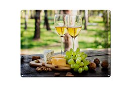  White wine glasses, golden wine bottle, green grapes, decorative tin sign, wine themed wall art