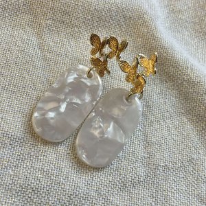 White pendant with butterfly