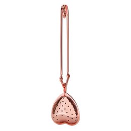 Rose gold tea infuser with heart-shaped design, suitable for steeping loose leaf tea.