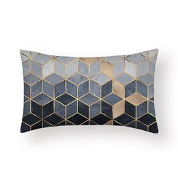 Square cushion cover with geometric pattern in shades of gray, beige, and black.