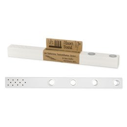 Off-white and grey dried flower holder with a wooden accent. Rectangular shape with perforated design.