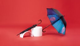 Straight art umbrella with a vibrant blue and purple pattern, featuring a unique design that includes a white mug or cup attached to the handle.