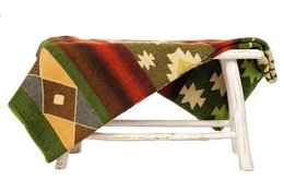 Ecuadorian alpaca blanket with native geometric patterns in green, red, and beige tones. Suitable for use as a bedspread or throw.