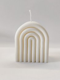 Tall, wide, rainbow-colored pillar candle with a unique arched design.