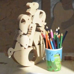 Wooden balance game with various shapes for kids. Includes a drawstring bag for storage and transport.