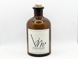 A large amber-colored glass bottle with a white label that reads "Vhr". The bottle has a cork stopper on top. The bottle is surrounded by smaller glass bottles and reed diffuser sticks, all in a similar amber color.
The product appears to be a reed diffuser set, likely containing essential oils or fragrance. The large bottle is the main diffuser, while the smaller bottles and reed sticks are likely additional fragrance refills or accessories.
The product description could include the following details:
Amber Reed Diffuser - 1000ML
Category: Home Fragrance
Scent Variants: Sapin Magique, Joie de Noël, Douceur Coton, Sous la Couette, Thé à la Bergamote, Rêve d'Orient, Île Paradisiaque, Zeste de Yuzu, Rosalia, Petit Soleil du Midi, Figue de Provence, Cerisier en Fleur, Heracles, Ulixes, Jardins du Sud, Fruits d'été
Material: Glass, Reed Sticks
Color: Amber
Shape: Tall, round bottle
This description covers the key details about the product, including the size, category, scent options, materials, color, and shape. It provides enough information for a semantic search to find this product based on relevant keywords.