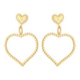 "Double Heart Statement Earrings in gold tone with heart-shaped design and beaded detailing."
The image shows a pair of statement earrings with a heart-shaped design. The earrings are made of gold-toned metal and feature a beaded texture, creating a decorative and eye-catching look. The heart shape at the top of the earrings is a key design element, making these earrings a bold and stylish accessory.