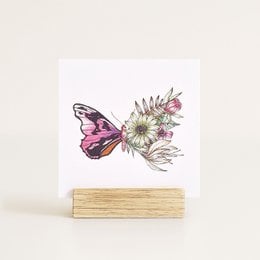 Colorful butterfly with floral design on a greeting card.