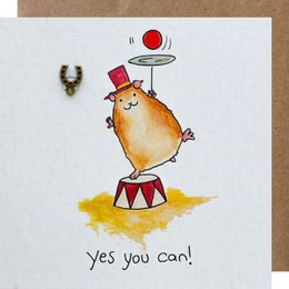 A whimsical illustration of a chick-like character standing on a drum and holding a red balloon, with the text "Yes you can!" This card appears to be part of a collection of greeting cards with inspirational or motivational messages.