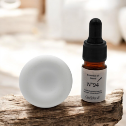 Handmade ceramic car diffuser with round shape, designed for essential oil diffusion in vehicles.