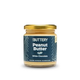 Creamy peanut butter with white chocolate, a delightful blend of flavors. The jar features a navy blue label with gold accents, giving it an elegant and premium appearance.
