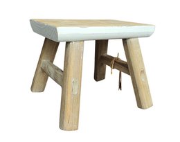 A rustic, wooden stool with a square seat and angled legs, suitable for use as a side table or footrest.