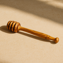  Olive wood honey dipper with round bulbous head, natural wood grain, warm golden-brown color, long handle kitchen tool.