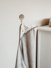 Grey hooded bath cape for kids, made of soft and absorbent material.