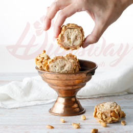 Loukoum Sarma Snickers 1kg - Gummy candies in a glass dish, featuring a variety of shapes and textures, including chewy, crunchy, and creamy elements.