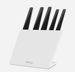 Set of 5 black knives in a white knife block. Includes chef's knife, bread knife, utility knife, paring knife, and carving knife.