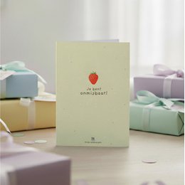  Pale yellow greeting card with red strawberry illustration, Dutch text "Je bent onmisbaar", friendship card design.