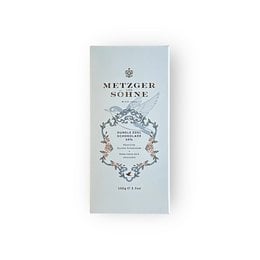 Dark chocolate bar, elegant ornate design, premium packaging, light gray wrapper, sophisticated aesthetic