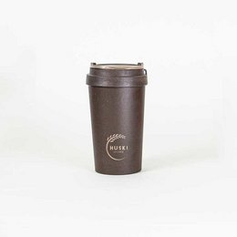 A brown leather travel coffee cup with a metal lid and Green Coffee logo.