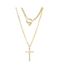 A gold-tone necklace with a double chain, a stone ring, and cross pendants. The necklace features a delicate and elegant design, perfect for adding a touch of style to any outfit.