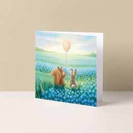  Winter forest scene with deer, snowman, and Christmas tree on a holiday greeting card.