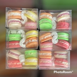 Colorful macaron wax melts in clear packaging. Includes a variety of pastel-colored macarons in different flavors.