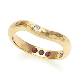 A hammered gold ring with a diamond and ruby accents, perfect for making a statement.

The Pre-Set Hidden Inner Strength Ring in Gold Hammered features a textured, hammered gold band with a single diamond accent and three ruby accents. The ring has a bold, statement-making design that would pair well with casual or formal attire. The hammered finish gives the ring a unique, artisanal look. This ring would be a great choice for someone looking to add a touch of glamour and personality to their jewelry collection.