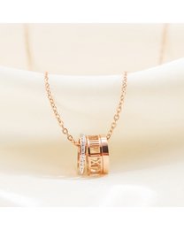 A delicate rose gold necklace featuring three interlocking rings, creating a chic and minimalist charm pendant.