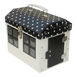A black and white polka dot patterned suitcase-style storage box with a handle and windows. The box appears to be a decorative storage or organizational item, likely intended for use in a child's room or playroom.