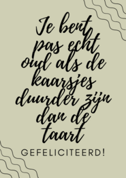 A birthday card with a humorous message in Dutch that translates to "You're only really old when the candles cost more than the cake." The card features hand-lettered text against a light background with decorative elements.