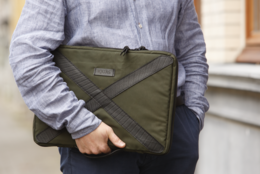 Olive green laptop sleeve, available in 14" and 16" sizes, with a minimalist, modern design.