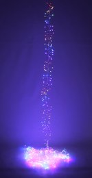  A string of colorful LED lights in red, green, blue, and pink, creating a festive and vibrant display for Christmas lighting.