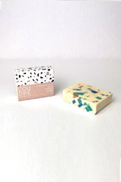  Handcrafted limestone soap bar with a patterned design on the packaging.