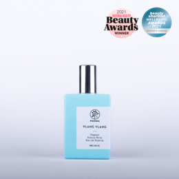 Ylang Ylang Organic Single Note Eau de Parfum, a floral, calming fragrance in a blue glass bottle.