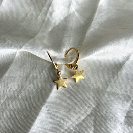 Gold star-shaped hoop earrings with a minimalist design.