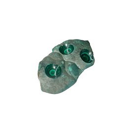  Rough malachite crystal with green, circular inclusions. Irregular, natural shape.